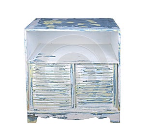 Old painted wooden cabinet with louvered doors isolated photo