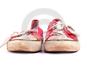 Old pair of red sneakers