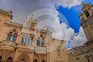 Old palace in Saint Paul`s Square of Mdina, in the center of the island of Malta: view of the Casa Gourgion neo-Gothic palace near