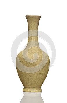 Old pale yellow crackle glaze vase isolated on white background.