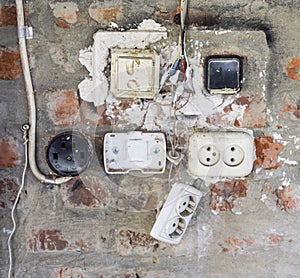 Old panel with switches and sockets. Old electrical wiring