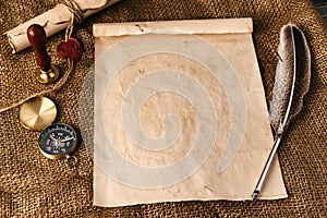 Old paper with compass and quill pen top view photo