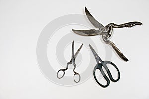 Old paper cutting scissors on a white background.