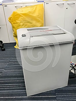 Old paper shredding machine in office for classified information and docuements