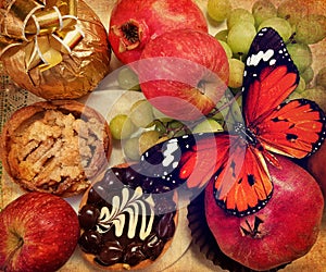 Old paper texture with gorgeous ripe sweet fruit and cream cakes. Red apples, pomegranates and green grapes. Edible gift