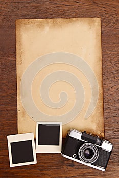 Old paper and vintage photo frame with camera