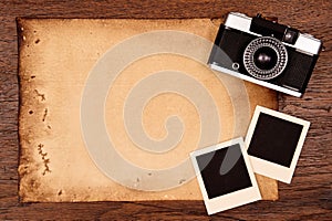 Old paper and vintage photo frame with camera