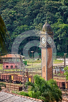 Old Paranapiacaba Clock Tower In The Train Station in Santo Andre District, Sao Paulo, Brazil. Railway Carriages And Railroad. photo