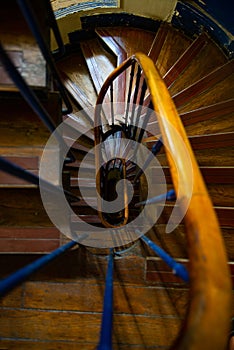 Old Parisian wooden spiral staircase. Old French architecture