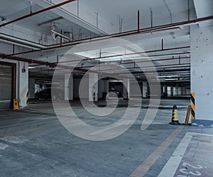 old parking lot with lighting, concrete building