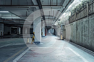 old parking lot with lighting, concrete building