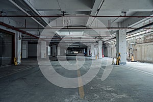 old parking lot with lighting, concrete building