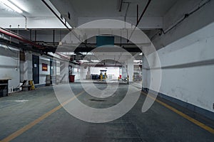 old parking lot with lighting, concrete building