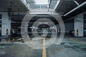 old parking lot with lighting, concrete building