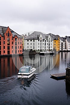 Old part of Ãâ¦lesund city where the river flows through the city, Norway photo