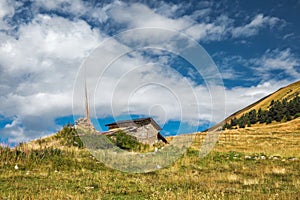 Old partly ruined shepherd`s stone building standing on a hill in mountains of Svaneti Georgia