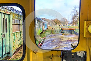 Old passenger carriage seen through window on blurred background