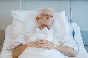 Old patient lying on bed