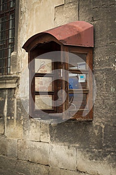 Old payphone on the stone wall