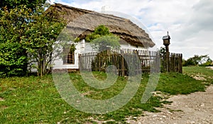 Old peasant house with thatched roof