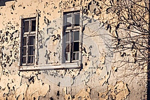 Old Peeling Yellow Wall with Two Windows