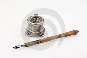 Old pen and antique metallic inkwell photo