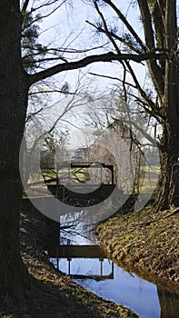 Old penstock, in the public park, with castle Favorite, Foerch