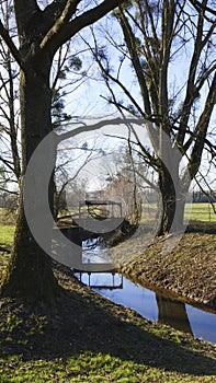 Old penstock, in the public park, with castle Favorite, Foerch