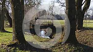 Old penstock, in the public park, with castle Favorite, Foerch