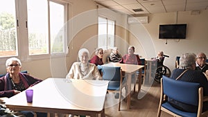Old people gathering in lounge of retirement home