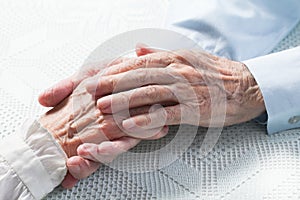 Old people holding hands