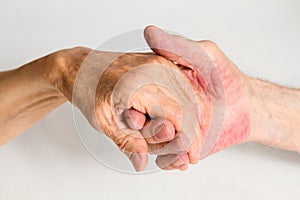 Old people holding hands. Closeup.