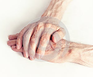 Old people holding hands. Closeup.