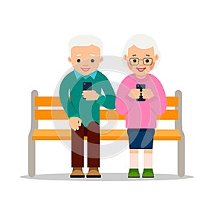 Old people on phones. Couple of elderly pensioners sit on a bench in park. Aged person chat with friends or family members using