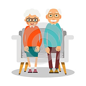 Old people sitting. On the sofa sit elderly woman and man. Famil