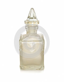 Old perfume bottle on white background