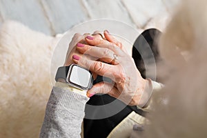 Old person using smart watch