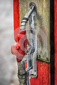 Old petrol station with vintage fuel pump and country side attributes