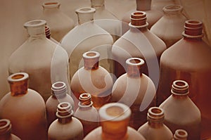 Old pharmacy bottles covered with dust