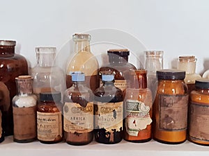 Old pharmacy, some old medicine bottles on a shelf.