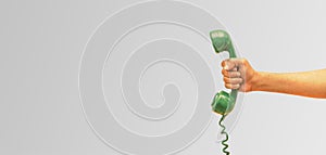 Old phone receiver in hand, businessman holding The old phone receiver, banner background