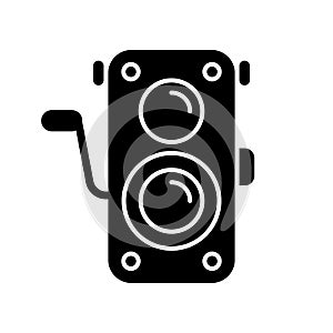 Old photo camera black glyph icon