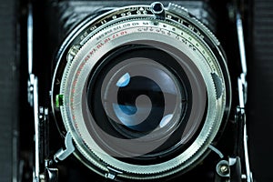 Old photo camera lens closeup