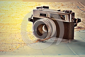 Old photo camera on world map