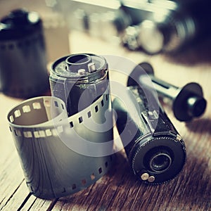 Old photo film rolls, cassette and retro camera.