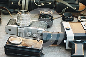 old photo and video equipment. vintage lenses. The flea market sells old cameras, camcorders, lenses and bags