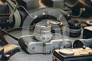 old photo and video equipment. vintage lenses. The flea market sells old cameras, camcorders, lenses and bags