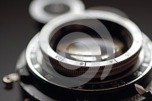 Old photographic lens close-up.