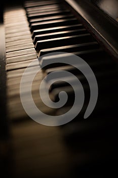 Old piano keyboard, with shallow depth of field