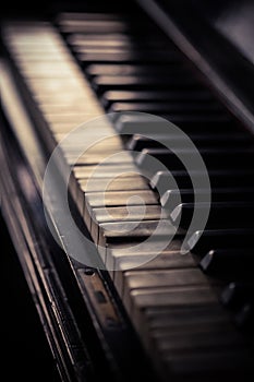 Old piano keyboard, with shallow depth of field